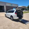 White Chrysler Voyager with Driverge Rear Entry Manual Fold Out conversion