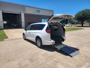White Chrysler Voyager with Driverge Rear Entry Manual Fold Out conversion