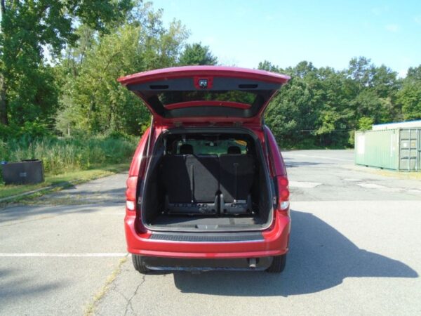 Red Dodge Grand Caravan with BraunAbility Side Entry Automatic Fold Out conversion