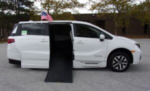White Honda Odyssey with BraunAbility Side Entry Automatic In Floor conversion