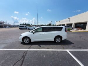 White Chrysler Voyager with Driverge Side Entry Automatic Fold Out conversion
