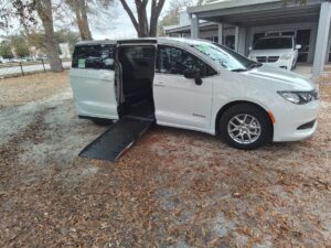 White Chrysler Voyager with Driverge Side Entry Automatic Fold Out conversion