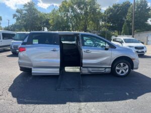 Silver Honda Odyssey with BraunAbility Side Entry Automatic In Floor conversion
