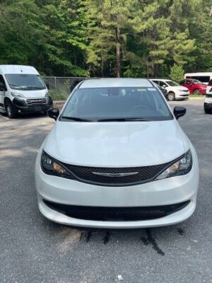 White Chrysler Voyager with Driverge Side Entry Automatic Fold Out conversion