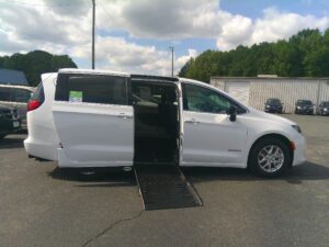 White Chrysler Voyager with Driverge Side Entry Automatic Fold Out conversion
