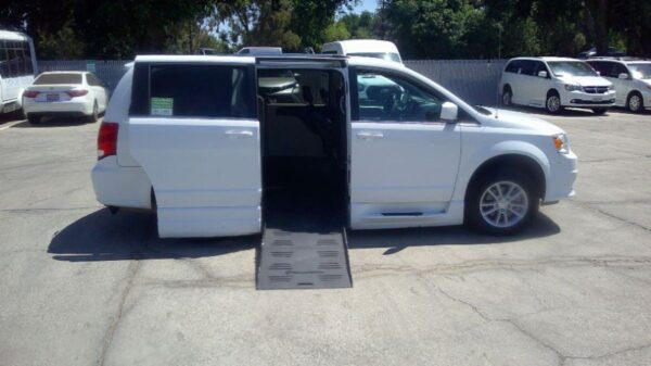 White Dodge Grand Caravan with BraunAbility Side Entry Automatic Fold Out conversion