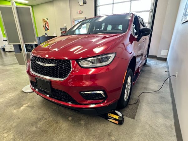 Red Chrysler Pacifica with BraunAbility Side Entry Automatic In Floor conversion
