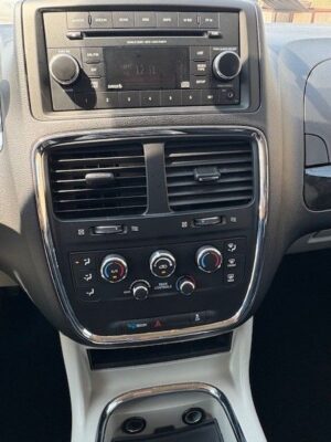 Black Dodge Grand Caravan with BraunAbility Side Entry Manual Fold Out conversion