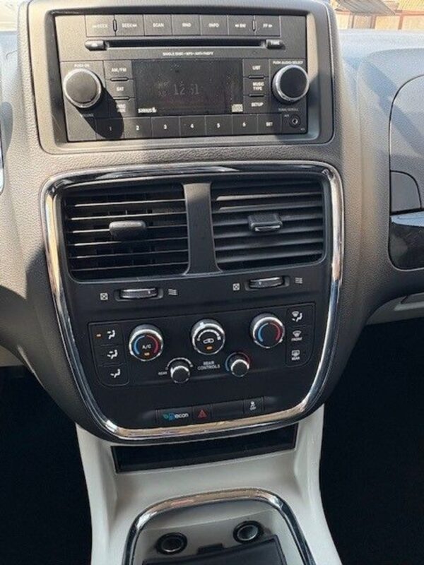 Black Dodge Grand Caravan with BraunAbility Side Entry Manual Fold Out conversion