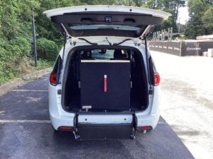 White Chrysler Pacifica with Driverge Rear Entry Manual Fold Out conversion