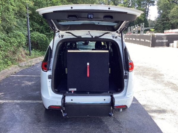 White Chrysler Pacifica with Driverge Rear Entry Manual Fold Out conversion