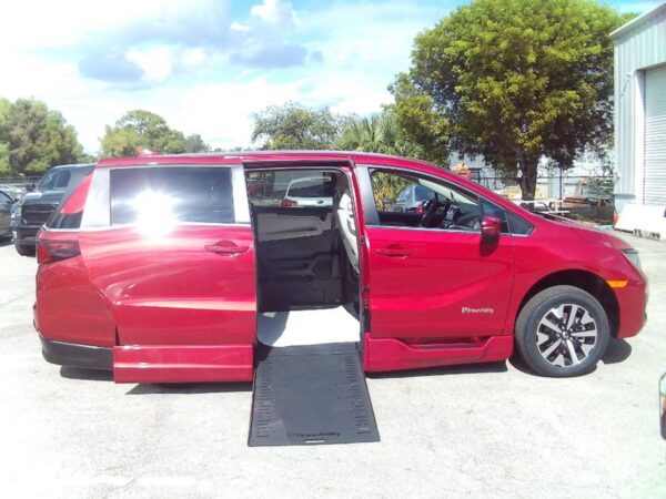 Red Honda Odyssey with BraunAbility Side Entry Automatic In Floor conversion