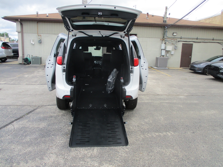 White Chrysler Voyager with FR Conversions Rear Entry Manual Fold Out conversion