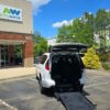 White Chrysler Voyager with BraunAbility Rear Entry Manual Fold Out conversion