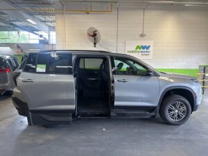 Grey Chevrolet Traverse with BraunAbility Side Entry Automatic In Floor conversion