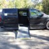 Black Dodge Grand Caravan with Driverge Side Entry Automatic Fold Out conversion