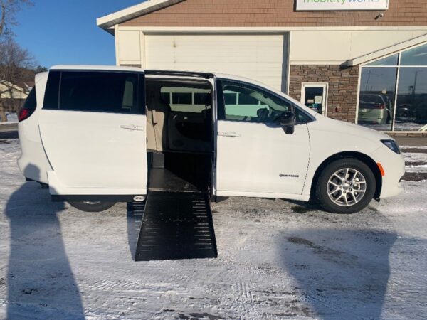 White Chrysler Voyager with Driverge Side Entry Automatic Fold Out conversion