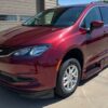 Red Chrysler Voyager with BraunAbility Side Entry Automatic In Floor conversion