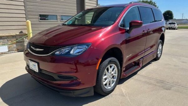 Red Chrysler Voyager with BraunAbility Side Entry Automatic In Floor conversion