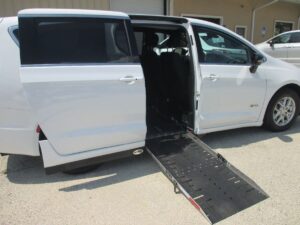 White Chrysler Pacifica with Driverge Side Entry Automatic Fold Out conversion