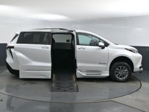 White Toyota Sienna with BraunAbility Side Entry Automatic Fold Out conversion