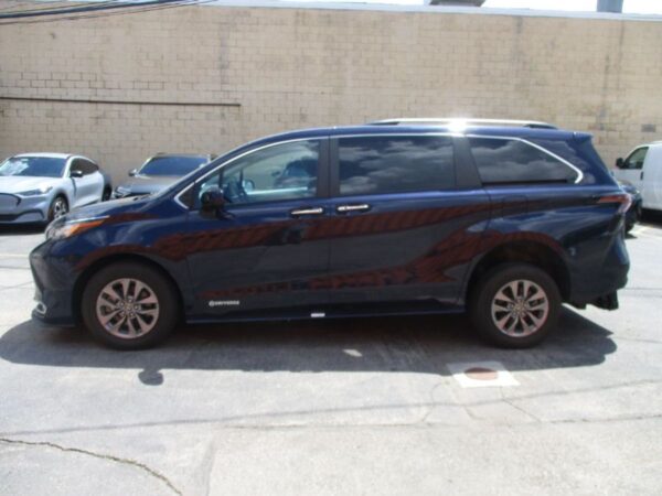Blue Toyota Sienna with Driverge Rear Entry Manual Fold Out conversion