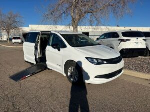 White Chrysler Voyager with Driverge Side Entry Automatic Fold Out conversion