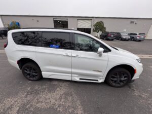 White Chrysler Pacifica with BraunAbility Side Entry Automatic Fold Out conversion