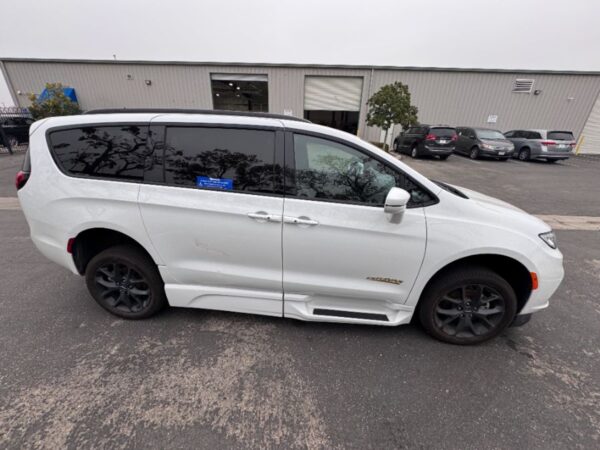 White Chrysler Pacifica with BraunAbility Side Entry Automatic Fold Out conversion