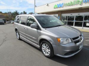 Silver Dodge Grand Caravan with Adaptive Vans Side Entry Automatic Fold Out conversion