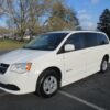 White Dodge Grand Caravan with BraunAbility Side Entry Automatic Fold Out conversion