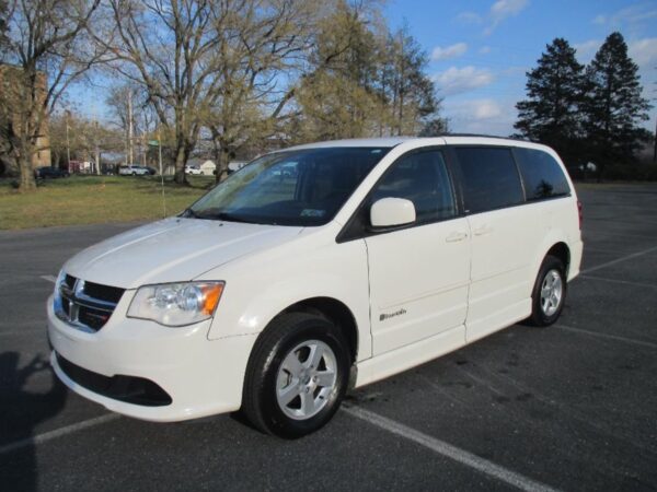White Dodge Grand Caravan with BraunAbility Side Entry Automatic Fold Out conversion