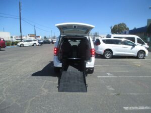 White Dodge Grand Caravan with Adaptive Vans Rear Entry Manual Fold Out conversion