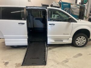 White Dodge Grand Caravan with BraunAbility Side Entry Manual Fold Out conversion