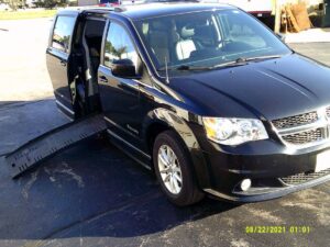 Black Dodge Grand Caravan with BraunAbility Side Entry Automatic Fold Out conversion