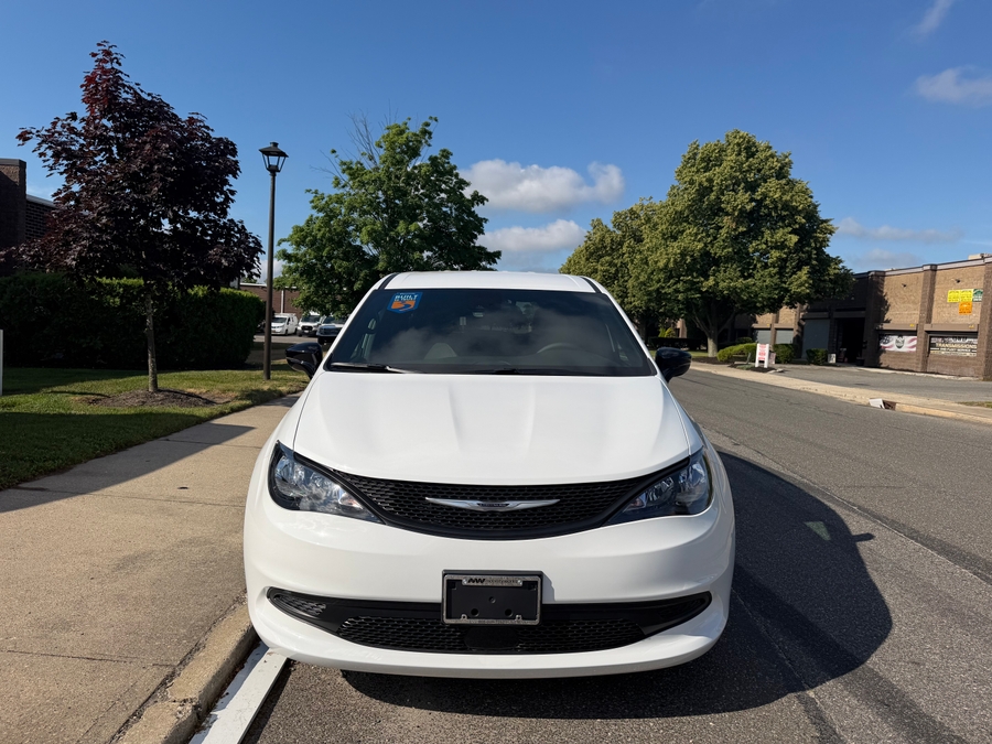 White Chrysler Voyager with BraunAbility Rear Entry Manual Fold Out conversion