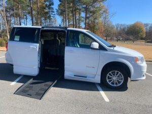 White Dodge Grand Caravan with BraunAbility Side Entry Automatic Fold Out conversion