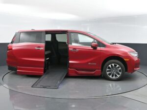 Red Honda Odyssey with BraunAbility Side Entry Automatic In Floor conversion