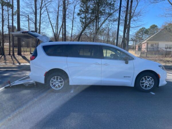 White Chrysler Voyager with Driverge Rear Entry Manual Fold Out conversion
