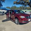 Red Dodge Grand Caravan with BraunAbility Side Entry Automatic Fold Out conversion