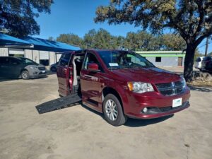 Red Dodge Grand Caravan with BraunAbility Side Entry Automatic Fold Out conversion