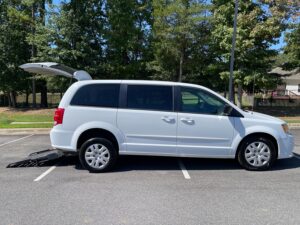 White Dodge Grand Caravan with FR Conversions Rear Entry Manual Fold Out conversion
