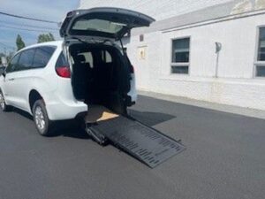 White Chrysler Voyager with BraunAbility Rear Entry Manual Fold Out conversion