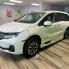 White Honda Odyssey with BraunAbility Side Entry Automatic In Floor conversion