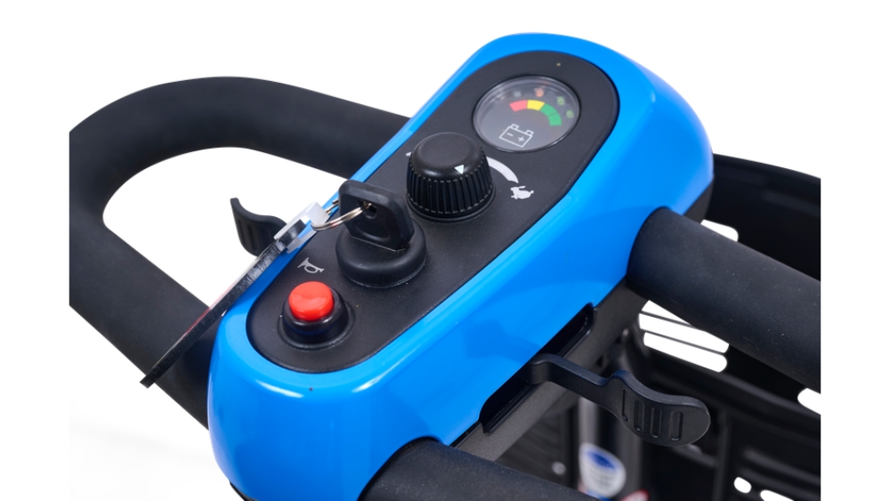 Close-up of a blue control panel on the BuzzAround EX 4-Wheel Scooter, featuring a dial, buttons, and a battery level indicator gauge.