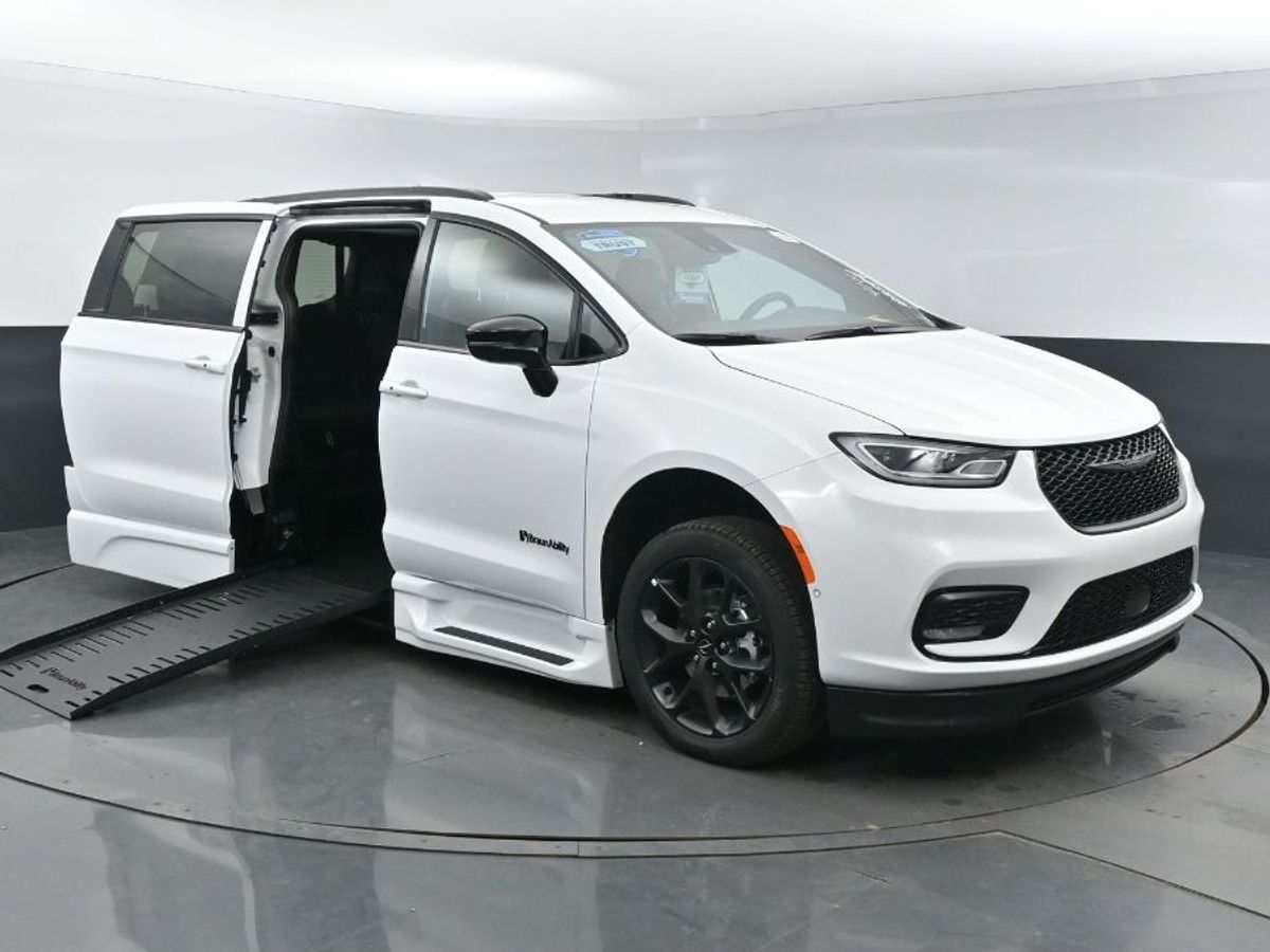 White Chrysler Pacifica with BraunAbility Side Entry Automatic Fold Out conversion