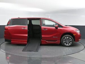 Red Honda Odyssey with BraunAbility Side Entry Automatic In Floor conversion