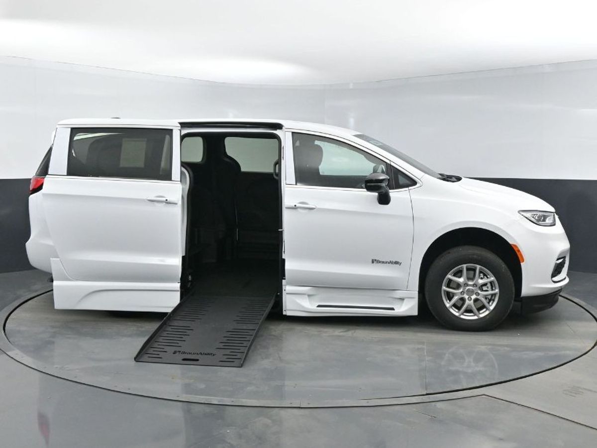 White Chrysler Pacifica with BraunAbility Side Entry Automatic Fold Out conversion