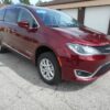 Red Chrysler Pacifica with BraunAbility Rear Entry Manual Fold Out conversion