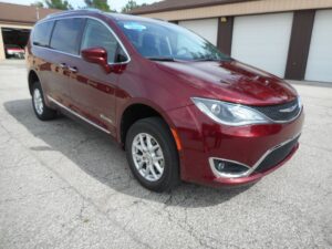 Red Chrysler Pacifica with BraunAbility Rear Entry Manual Fold Out conversion